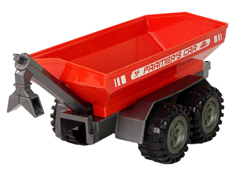 Trator verde com reboque vermelho fricção