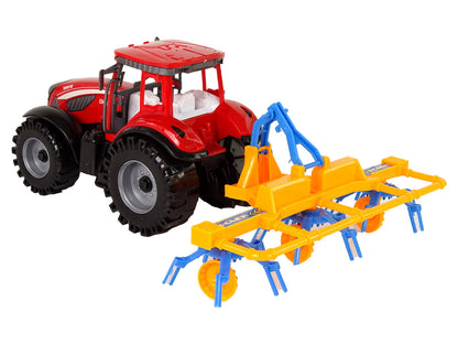 Trator vermelho com ancinho fricção