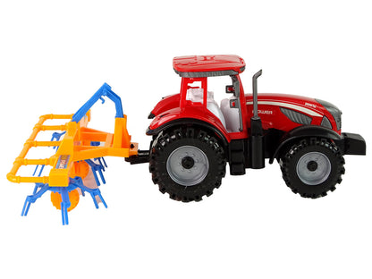 Trator vermelho com ancinho fricção