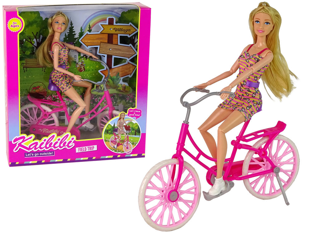Boneca com bicicleta rosa