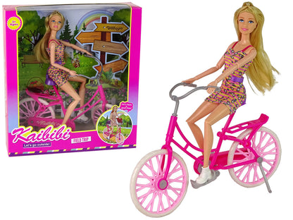 Boneca com bicicleta rosa