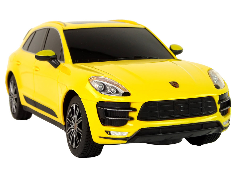 Carro telecomandado Porsche Macan Turbo Rastar amarelo 1:24