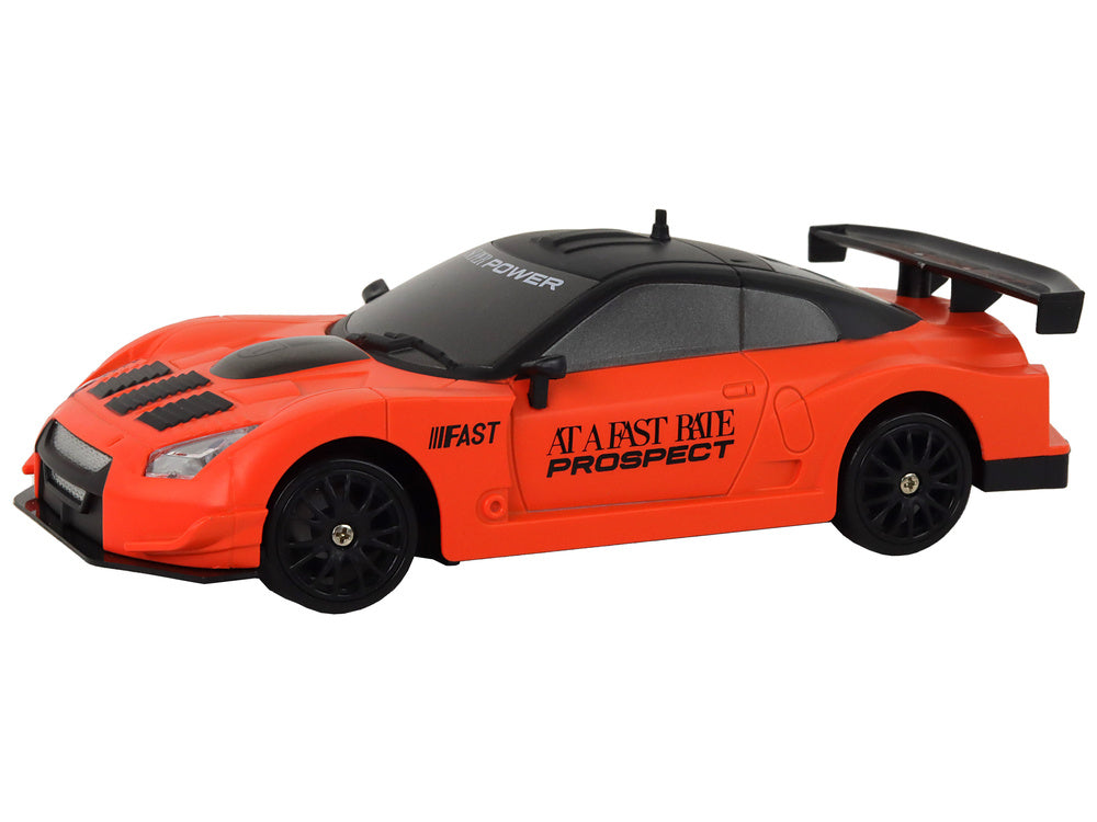 Carro Desportivo RC 1:24 Laranja com Rodas Intercambiáveis