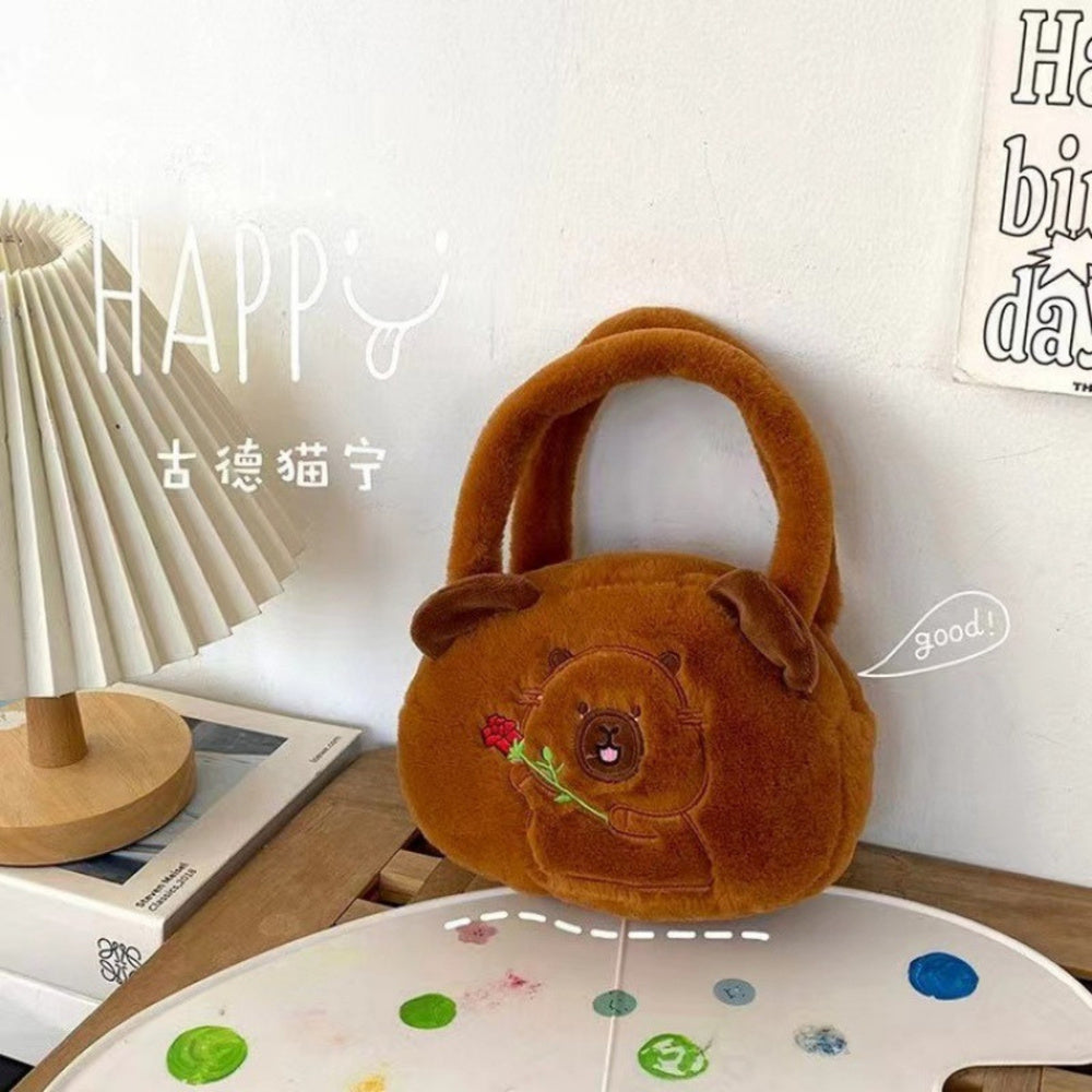 Mala de Peluche Capivara com Rosa Castanha 20cm